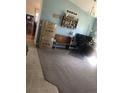 Office features hardwood flooring and an L-shaped desk workspace with comfortable seating at 1998 E 100Th Pl, Thornton, CO 80229