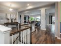 Elegant foyer with hardwood floors, staircase, and an open view to the bright and airy living area at 23130 E Del Norte Cir, Aurora, CO 80016