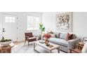 Inviting living room features chic furnishings, neutral color palette, and stylish decor for a cozy ambiance at 4025 E Martin Luther King Jr, Denver, CO 80207