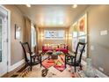 Cozy living room with a colorful rug, stylish seating, and bright artwork at 2604 Elm St, Denver, CO 80207