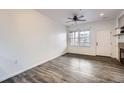 Bright living room with wood-look floors and access to a balcony at 16312 E Fremont Ave # 2, Aurora, CO 80016