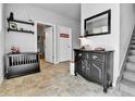 Stylish entryway with modern decor, including a decorative cabinet and mirror at 11250 Florence St # 21A, Commerce City, CO 80640