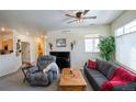 Bright living room featuring comfortable seating, large window, and neutral walls at 13708 Legend Trl # 101, Broomfield, CO 80023