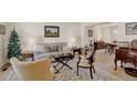 Inviting living room featuring a neutral color palette, plush seating, and elegant decor at 3556 Buffalo Ave, Broomfield, CO 80020