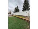 Spacious backyard featuring low maintenance turf and a well-kept privacy fence for outdoor enjoyment at 1137 S Coolidge Cir, Aurora, CO 80018