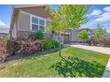 Charming two-story home featuring a stone facade, two-car garage, and well-maintained landscaping at 8844 S Sicily Ct, Aurora, CO 80016