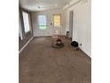 Living room featuring neutral colored carpet and natural light at 165 Garland St, Lakewood, CO 80226