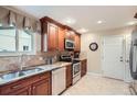 Modern kitchen with stainless steel appliances and ample cabinet space at 3544 Dyanna Dr, Thornton, CO 80241