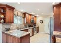 Bright kitchen featuring granite countertops and stainless steel appliances at 3544 Dyanna Dr, Thornton, CO 80241