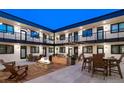 Beautifully styled courtyard with grill and tables at 2120 N Downing St # 216, Denver, CO 80205