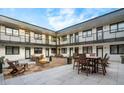 Well-appointed courtyard with lounge furniture and gas fire pit at 2120 N Downing St # 216, Denver, CO 80205