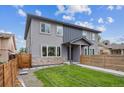 Beautiful exterior view of this two story home featuring modern architecture, stone accents, and well-maintained lawn at 2226 S Galapago St, Denver, CO 80223