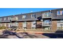 Rear view of the building, showing balconies and parking at 309 E Highline Cir # 103, Centennial, CO 80122