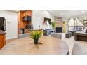 Open concept dining area with kitchen and living room views at 10273 E Peakview Ave # D202, Englewood, CO 80111