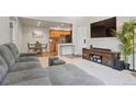Open concept kitchen and dining area with wood cabinets at 10273 E Peakview Ave # D202, Englewood, CO 80111