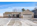 Charming home featuring a manicured lawn, attached garage, and inviting entrance in a desirable neighborhood at 10092 Lee St, Broomfield, CO 80021