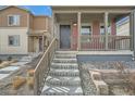 Charming two-story home with a covered porch and inviting entrance at 12770 Tamarac St, Thornton, CO 80602