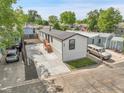 Bird's eye view of a single-story home with spacious driveway and surrounded by lush greenery at 8497 Madison Way, Denver, CO 80229