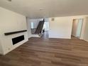 Spacious living room features wood floors, a fireplace, and plenty of natural light at 1131 Joseph Pl, Erie, CO 80026
