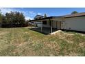 Spacious backyard featuring a covered patio, perfect for outdoor entertaining and relaxation at 2513 S Crystal St, Aurora, CO 80014