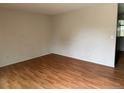 Empty bedroom with wood-look floors and neutral walls, ready for personalization at 2513 S Crystal St, Aurora, CO 80014