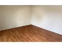 Empty bedroom with wood-look floors and neutral walls, ready for personalization at 2513 S Crystal St, Aurora, CO 80014