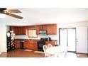 Updated kitchen features granite counters, modern appliances, and an eat-in dining area at 11068 Eudora Cir, Thornton, CO 80233
