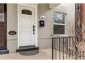 A close-up of the front door, featuring vintage architecture and the year built, 1904 at 204 S Logan St, Denver, CO 80209
