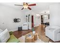 Inviting living area boasting hardwood floors and seamless flow to the dining area and staircase at 204 S Logan St, Denver, CO 80209