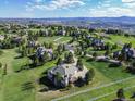 Picturesque aerial view of a residential area nestled in rolling hills, showing mountain views and spacious lots at 485 Sapphire Dr, Castle Rock, CO 80108