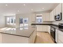 Modern kitchen featuring stainless steel appliances, light cabinets, and a large center island at 24716 E Evans Dr, Aurora, CO 80018