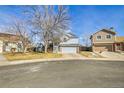 Exterior shot of a two-story home in a suburban neighborhood, featuring a two-car garage and tidy front lawn at 270 N Holcomb Cir, Castle Rock, CO 80104