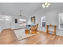 Bright living room boasts vaulted ceilings, wood floors, a ceiling fan, and ample natural light at 270 N Holcomb Cir, Castle Rock, CO 80104