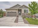 Beautiful single Gathering home featuring landscaped front yard and covered front porch at 8153 S Ider Ct, Aurora, CO 80016