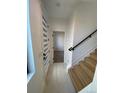 Bright entryway with light wood floors and modern staircase at 1252 Yates St, Denver, CO 80204