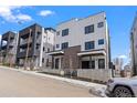 Contemporary townhomes featuring clean lines, dark window frames, and a modern aesthetic at 1252 Yates St, Denver, CO 80204