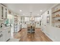 Bright, open kitchen with modern appliances, white cabinets, and a center island at 37625 Pheasant Run, Elizabeth, CO 80107