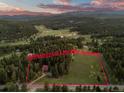 Aerial view of property with approximate lot lines showing the expansive acreage at 8821 Blue Creek Rd, Evergreen, CO 80439