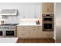 Well-equipped kitchen featuring modern cabinets and stainless steel oven appliance at 2524 Zenobia St, Denver, CO 80212