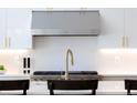 Contemporary kitchen featuring a gold faucet and a view of the stainless steel oven at 2524 Zenobia St, Denver, CO 80212
