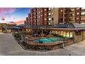 Inviting outdoor pool area with comfortable seating and a glimpse of the building's exterior at 405 Village Rd # 101, Breckenridge, CO 80424