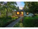 Inviting home with a covered porch, manicured lawn, and a walkway leading to the entrance at 331 Sherman St, Longmont, CO 80501