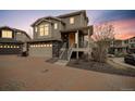Charming two-story home featuring a two-car garage and a welcoming entrance at 8095 E 128Th Pl, Thornton, CO 80602