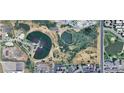 Aerial view of property with a baseball field nearby, showcasing community features and surrounding area at 2005 W 86Th Ave, Denver, CO 80260