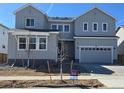 Beautiful two-story home with a gray facade and well-manicured lawn at 2560 Wesley Ln, Lafayette, CO 80026