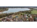 Picturesque aerial view of a neighborhood showcasing lush trees, tranquil ponds, and serene landscape at 5497 W Prentice Ct, Littleton, CO 80123