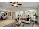 Bright open-concept living room with hardwood floors and natural light at 2840 Canyon Crest Ln, Highlands Ranch, CO 80126