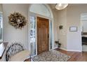 Bright and spacious entryway with hardwood floors and decorative wreath at 334 Humphrey Dr, Evergreen, CO 80439