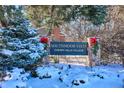 Community entrance sign, snow-covered landscaping at 6279 E Princeton Ave, Cherry Hills Village, CO 80111