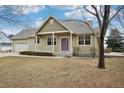 Lovely home with a beautiful yard and a cozy front porch, perfect for relaxing at 616 Wild Ridge Cir, Lafayette, CO 80026